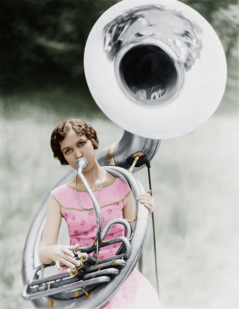 Smiling Girl Playing Tuba High-Res Stock Photo - Getty Images