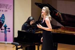 An opera singer performs with a pianist